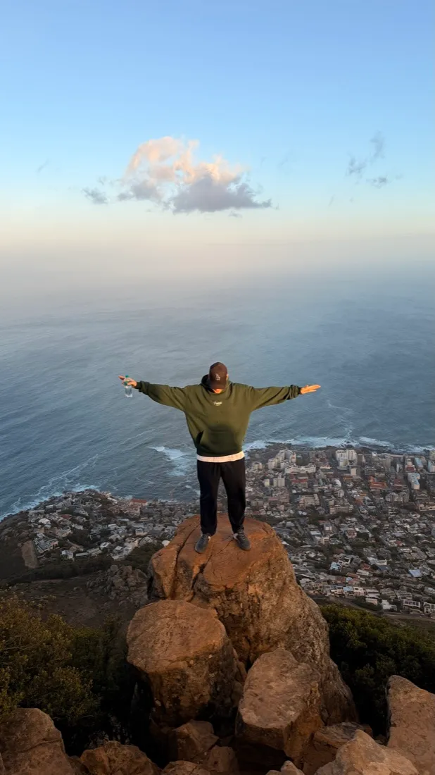 Julian with open arms above Cape Town